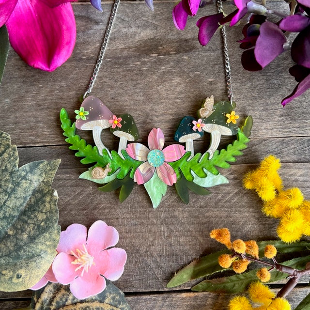 Necklace with mushrooms and flowers design